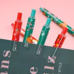 Golyóstoll, 0,5mm, karácsonyi mintás, piros vagy zöld testtel, 6 féle